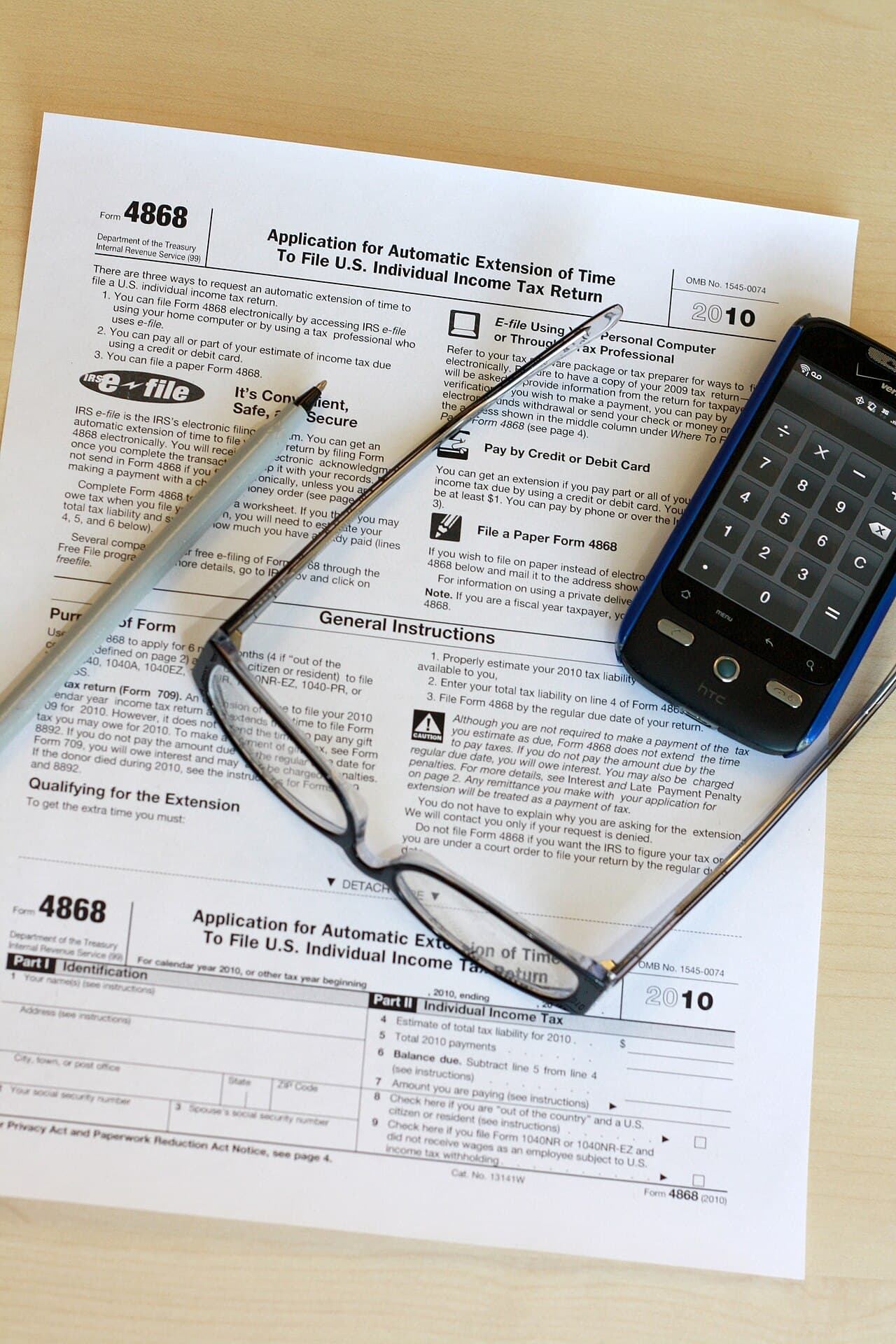 Tax form and desk items representing HRA and new tax regime comparison